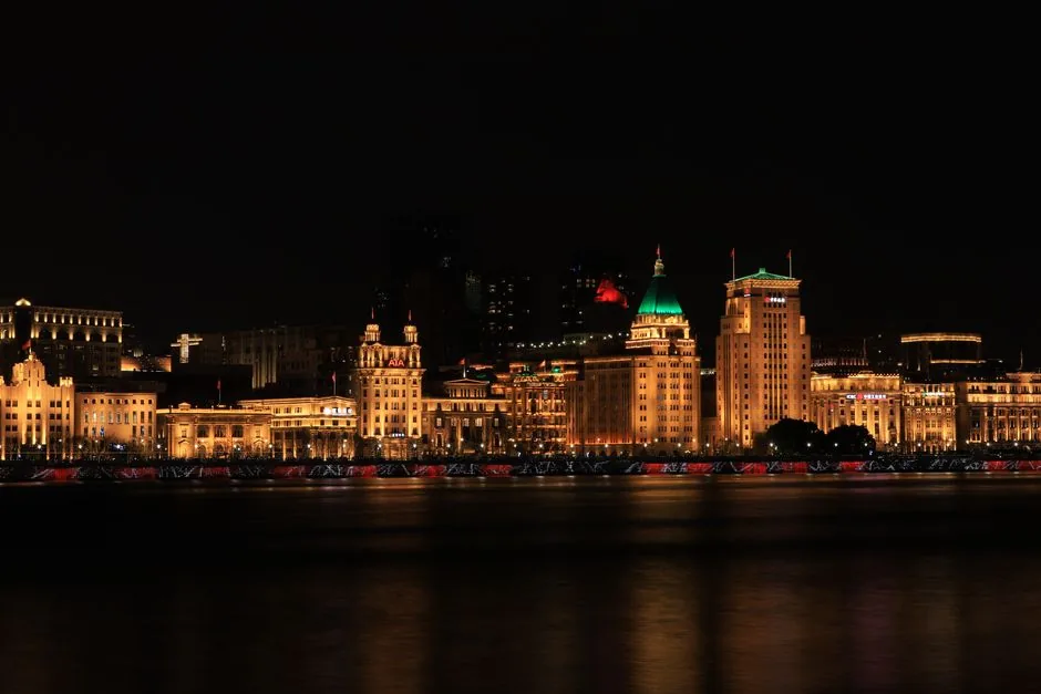 The Bund Shanghai at night — colonial buildings facing Pudong skyline