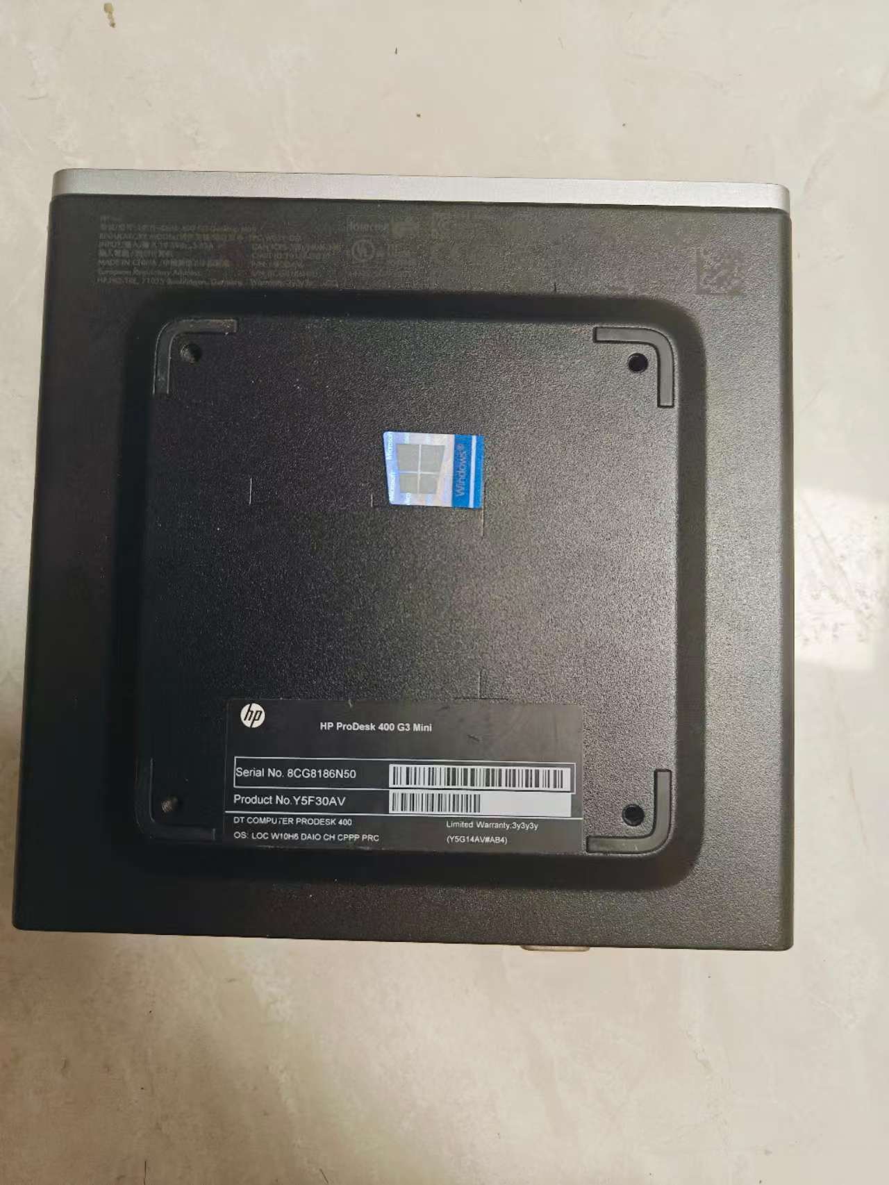 HP ProDesk 400 G3 Mini exterior — business-grey mini PC smaller than a tissue box, showing model label on bottom