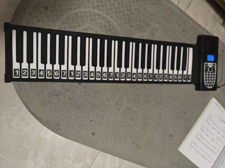My roll-up piano unrolled on the table — it sat in a box for 3 years