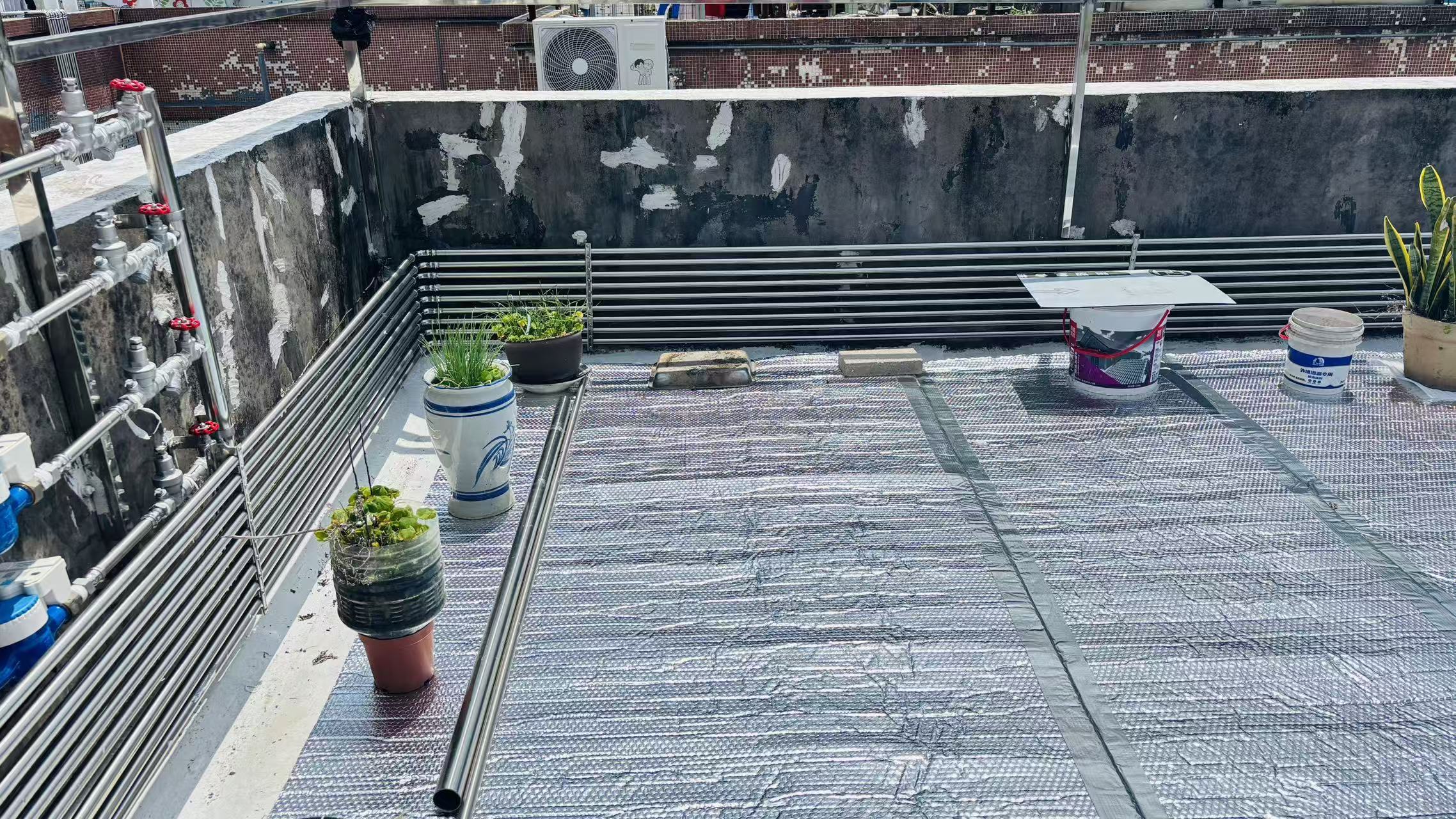 Close-up view of aluminum bubble insulation covering the rooftop terrace